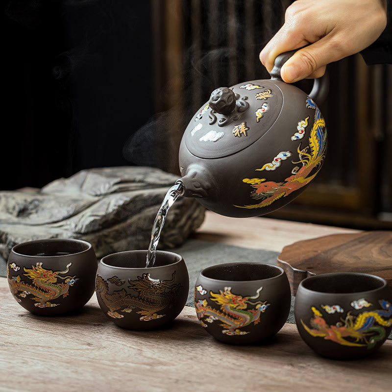 Dragon phoenix zisha tea set - pouring scene